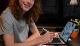 creator working on tablet and laptop