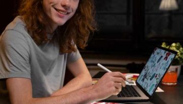 creator working on tablet and laptop