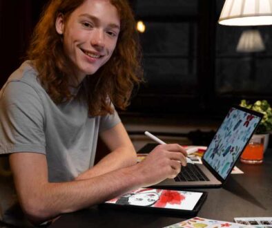 creator working on tablet and laptop